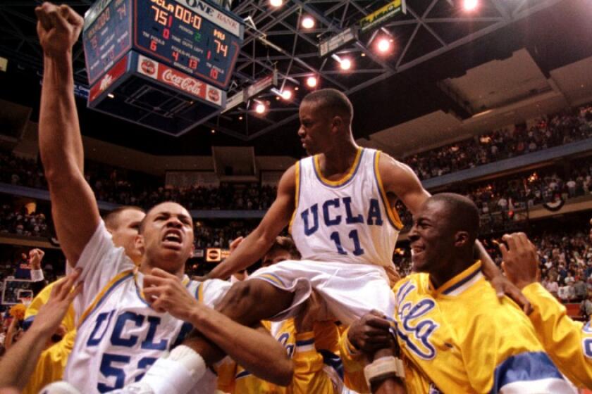 UCLA teammates give guard Tyus Edney a ride on their shoulders.