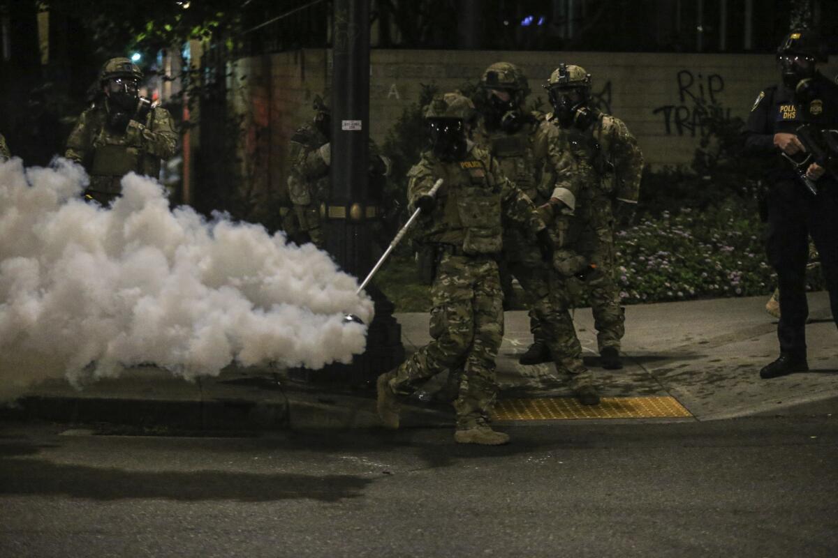 Militarized federal agents deployed by the president to Portland, Ore., in July fired tear gas against protesters.