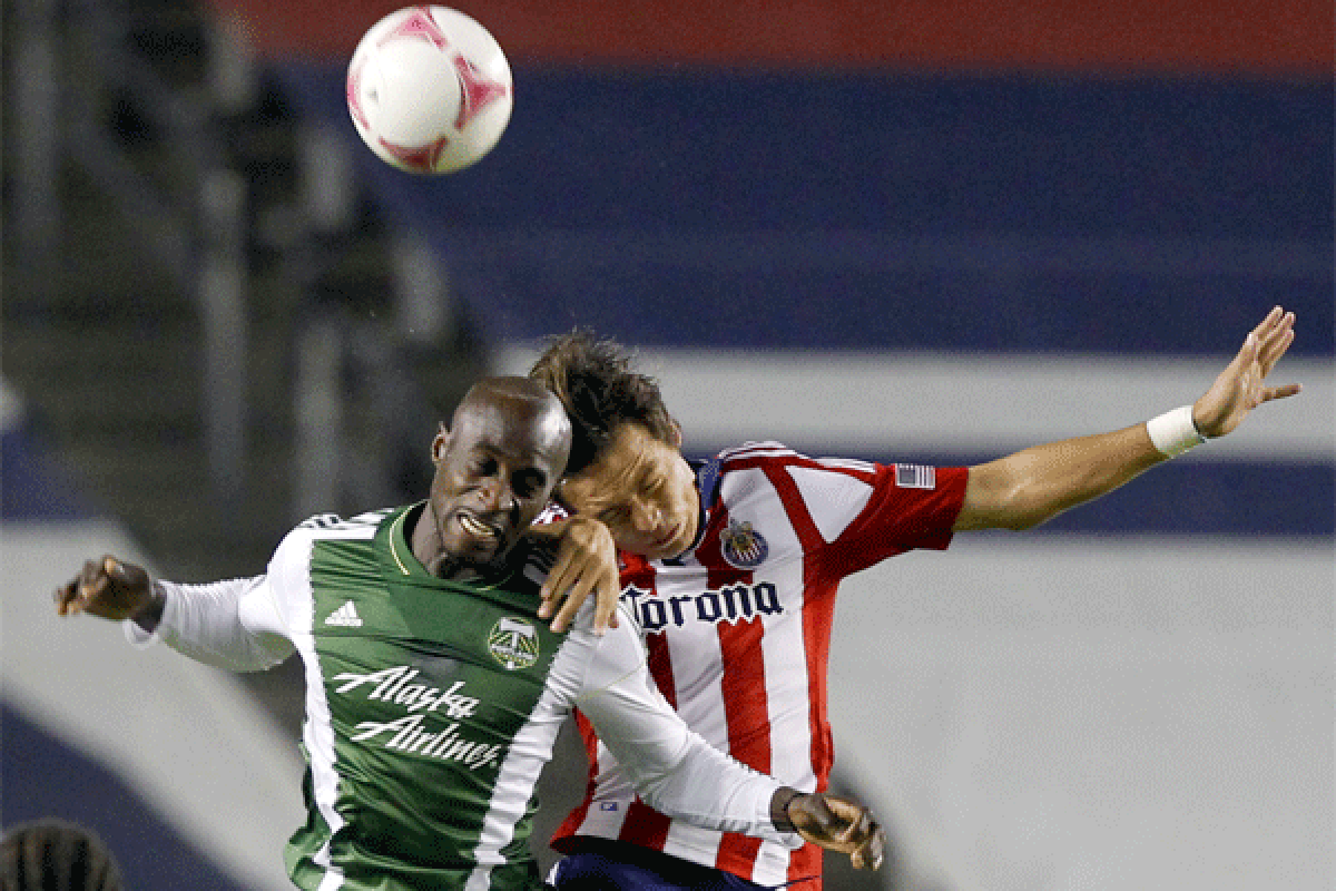 Chivas USA forward Erick Torres, right, battles Portland defender Mamadou Danso during an MLS game last season.