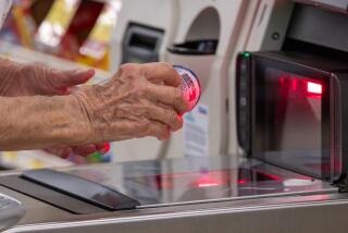 ARCADIA, CA - JULY 28: Elaine Ingram, 85, to avoid line uses self-checkout, shopping on Friday, July 28, 2023 at Albertsons in Arcadia, CA. (Irfan Khan / Los Angeles Times)