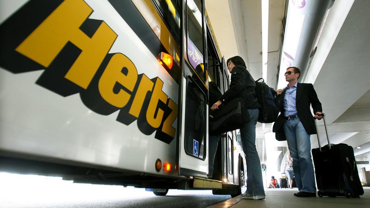 A satisfaction study by J.D. Power found that renting cars got the highest satisfaction ratings among all elements of travel. Above, customers board a Hertz rental bus at Los Angeles International Airport.