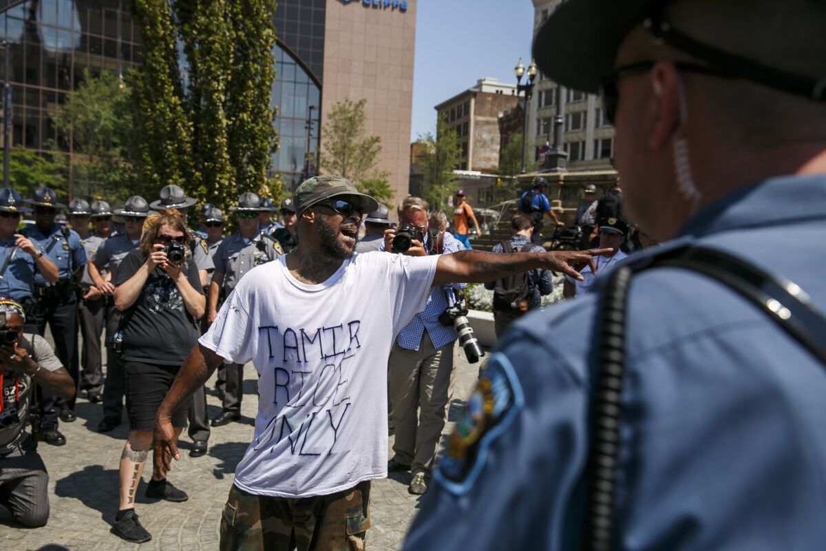 Stevedore Crawford Jr. of Delaware, Ohio, shouts at a police officer in Cleveland. (Marcus Yam / Los Angeles Times)