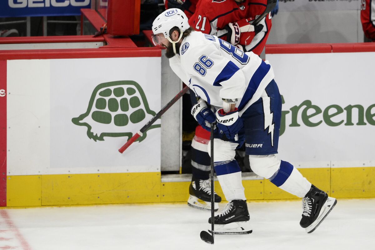Tampa Bay Lightning right wing Nikita Kucherov (86) makes his way to the bench after he was injured during the third period of an NHL hockey game against the Washington Capitals, Saturday, Oct. 16, 2021, in Washington. (AP Photo/Nick Wass)