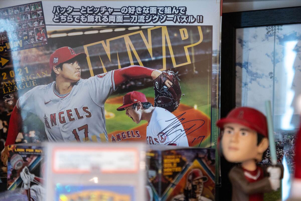 Baseball cards and bobbleheads of Shohei Ohtani.