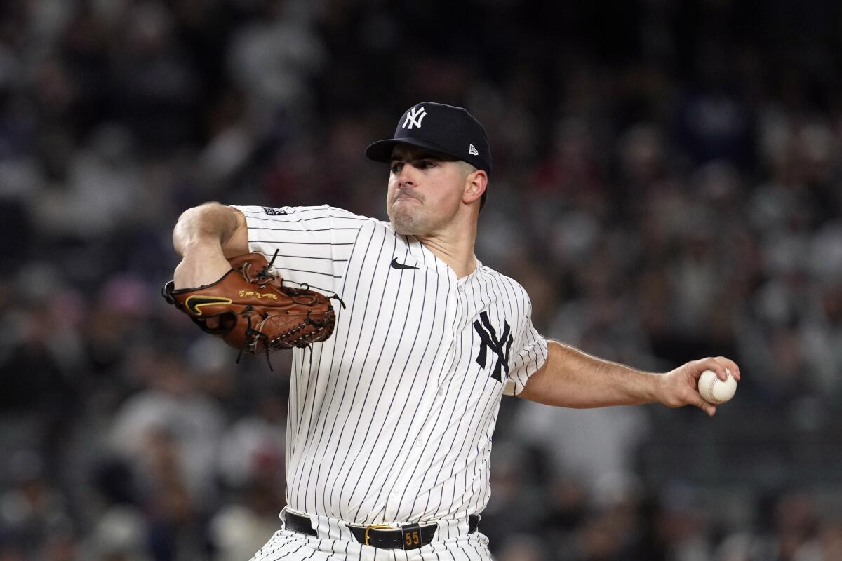 Yankees starting pitcher Carlos Rodón throws during the first inning in Game 1 of the ALCS against the Guardians.