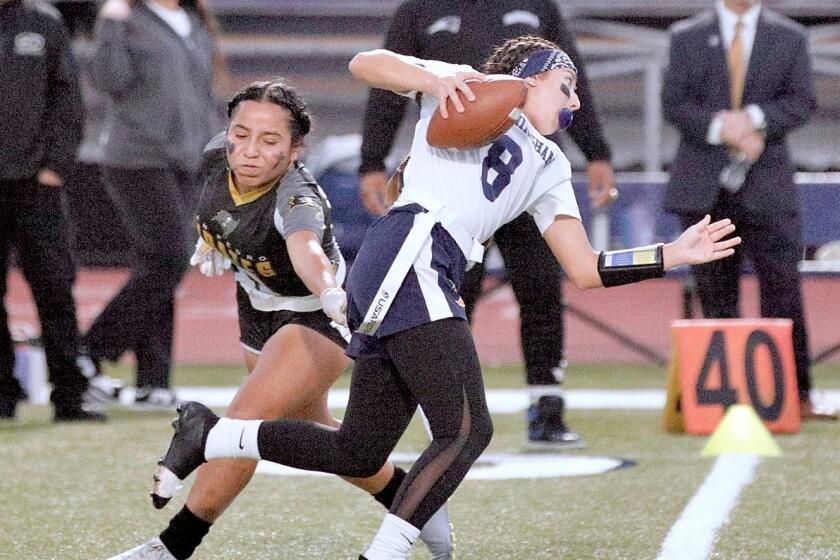 Birmingham quarterback Jessica Rose avoids a San Pedro defender.