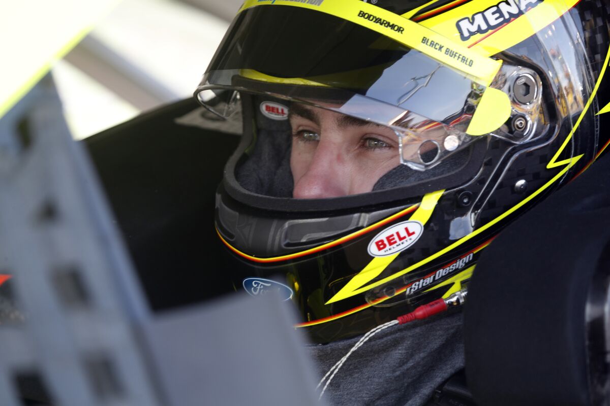 NASCAR Cup Series driver Ryan Blaney (12) waits in his car before a NASCAR Cup Series auto race at the Las Vegas Motor Speedway Sunday, Sept. 26, 2021, in Las Vegas. (AP Photo/Steve Marcus)