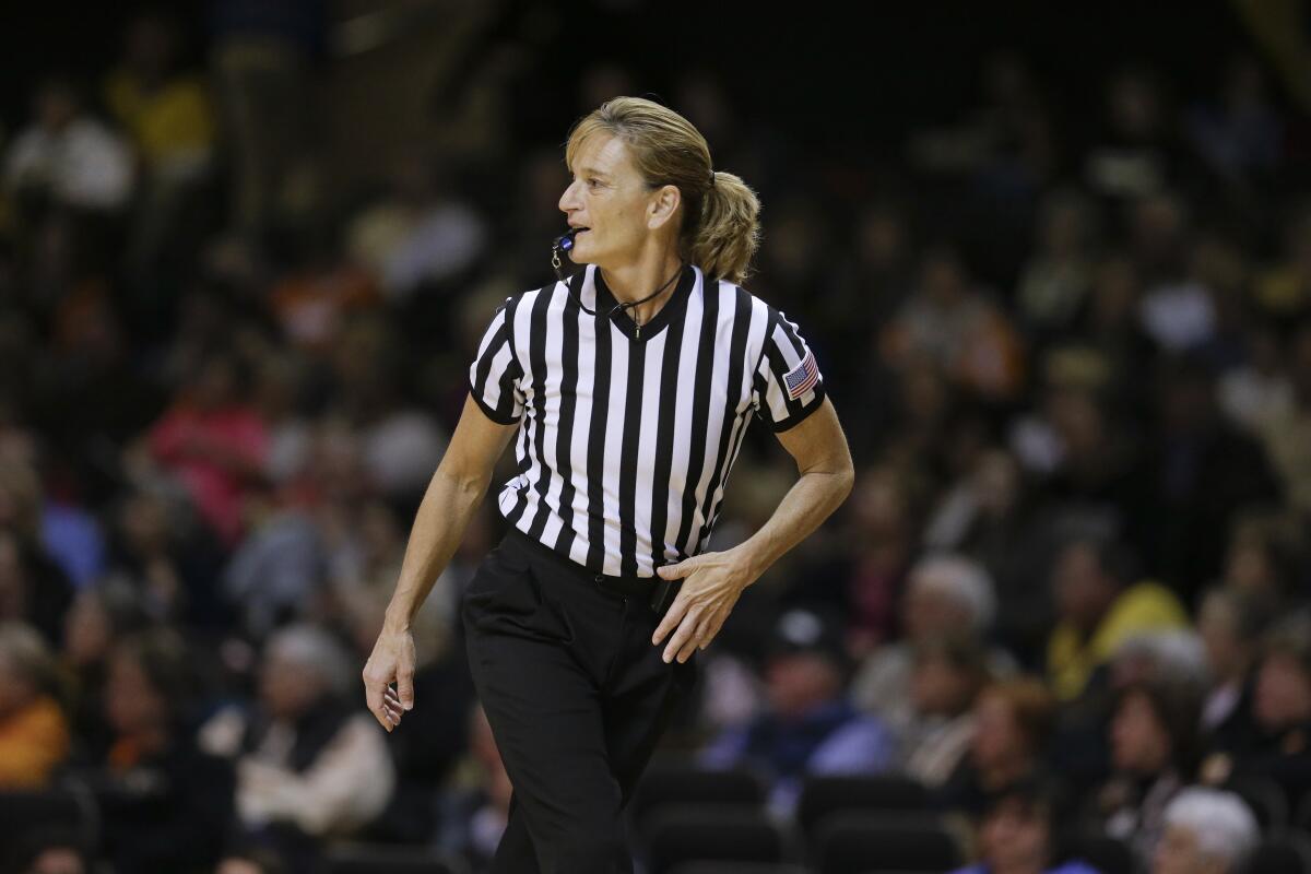 FILE - Referee Dee Kantner works in the second half of an NCAA college basketball game between Tennessee and Vanderbilt Monday, Jan. 5, 2015, in Nashville, Tenn. Kantner, a veteran referee of women’s games who works for multiple conferences, finds it frustrating to have to justify equal pay. “If I buy an airline ticket and tell them I’m doing a women’s basketball game they aren’t going to charge me less,” she said. (AP Photo/Mark Humphrey, FILE)