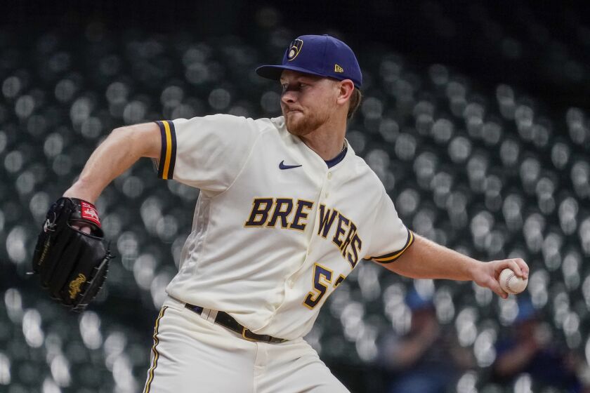 Milwaukee Brewers starting pitcher Eric Lauer throws during the first inning of a baseball game against the Arizona Diamondbacks Tuesday, Oct. 4, 2022, in Milwaukee. (AP Photo/Morry Gash)