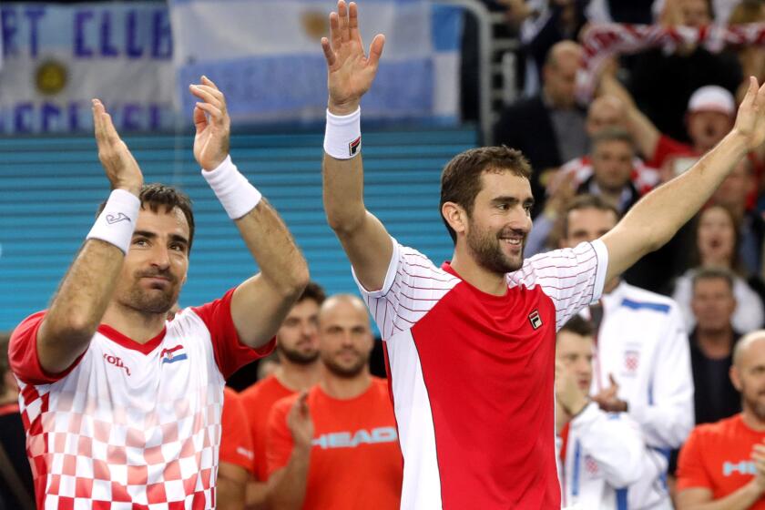 Croatia's Ivan Dodig, left, and Marin Cilic celebrate their doubles victory over Argentina's Juan Martin del Potro and Leonardo Mayer during the Davis Cup final on Saturday.