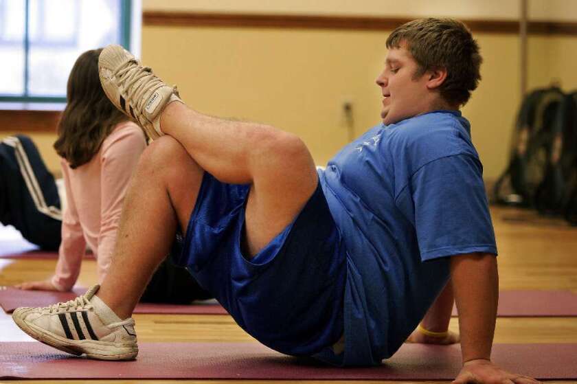 Most American kids who are overweight and more than one-third who are obese think their weight is just fine, a CDC study says. Above, a teen takes an aerobics class in Windber, Pa.