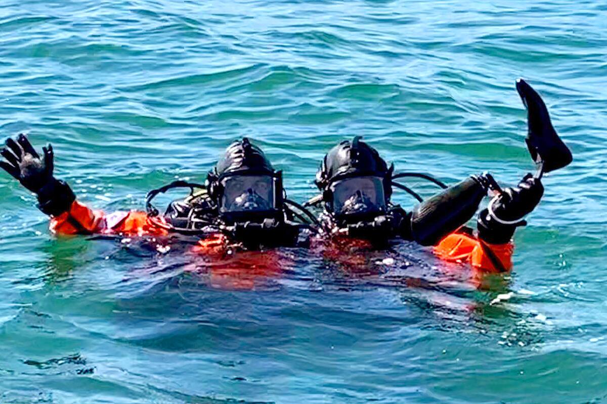 Divers from the Long Beach Fire Department with DeWalt Mix's prosthetic leg