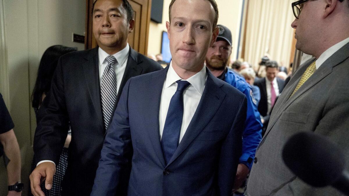 Facebook CEO Mark Zuckerberg departs after testifying before a House Energy and Commerce hearing in Washington on April 11.