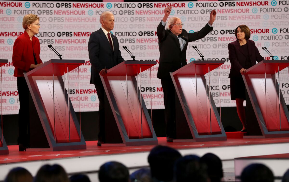 Elizabeth Warren, Joe Biden, Bernie Sanders and Amy Klobuchar in debate.