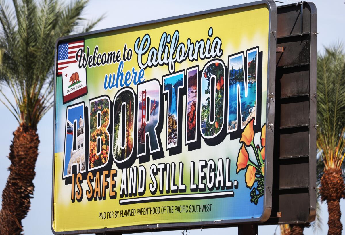  A billboard reads, 'Welcome to California where abortion is safe and still legal.' 