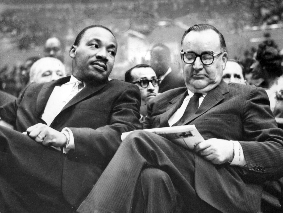 California Gov. Pat Brown with Rev. Martin Luther King, Jr. at the Sports Arena in Los Angeles on June 18, 1961.