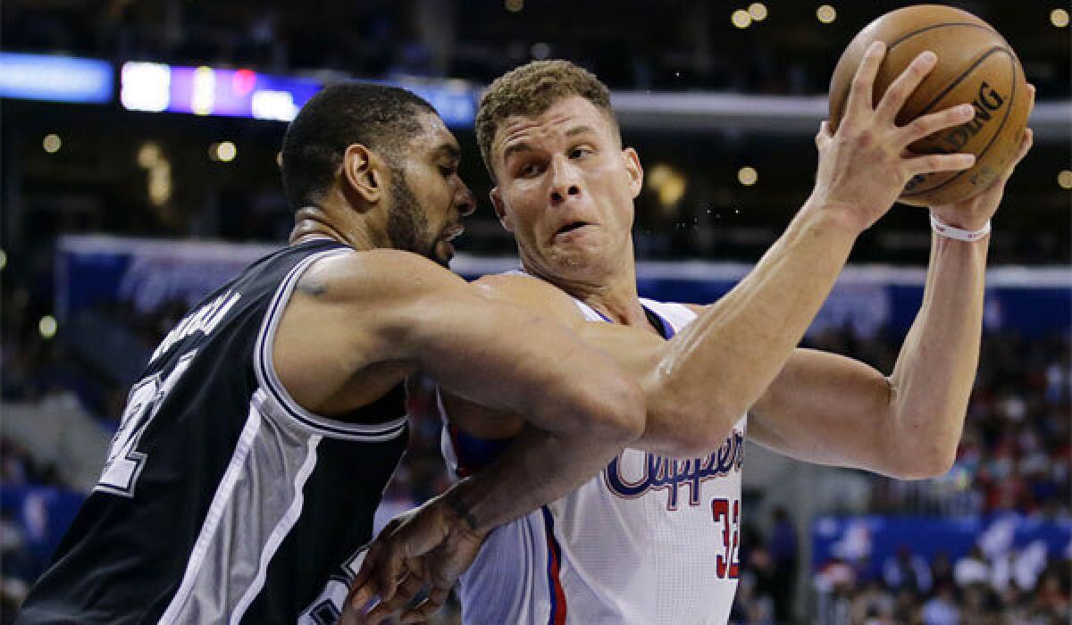 Blake Griffin, guarded by San Antonio's Tim Duncan, scored 27 points and went 11 for 15 from the free-throw line during the Clippers' 115-92 victory Monday over the Spurs.