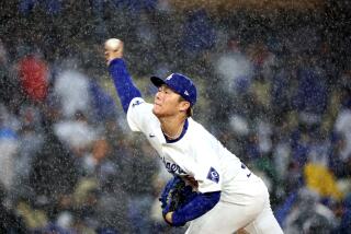 LOS ANGELES, CALIFORNIA - MARCH 30: Dodgers pitcher Yoshinobu Yamamoto throws a pitch.