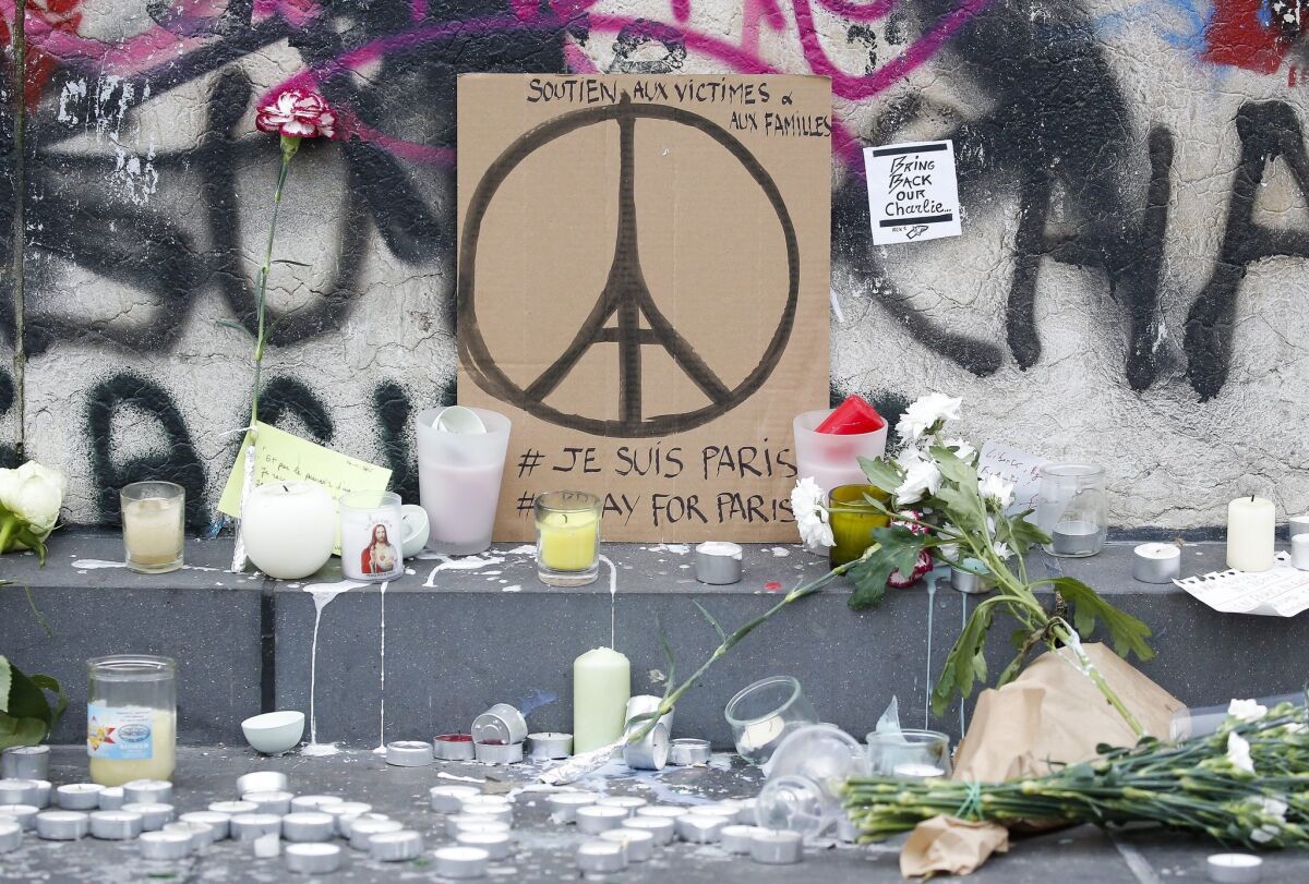 Memorials in Paris pay tribute to those killed in Friday's terror attacks.