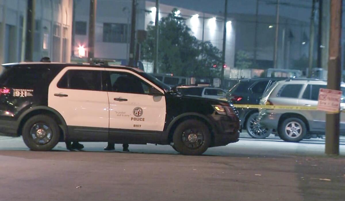 A police vehicle parked near a fatal shooting scene