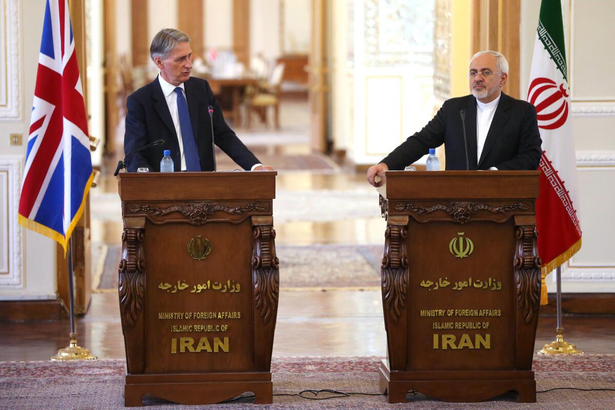 British Foreign Secretary Philip Hammond, left, at a press conference with Iranian Foreign Minister Mohammad Javad Zarif in Tehran on Sunday.