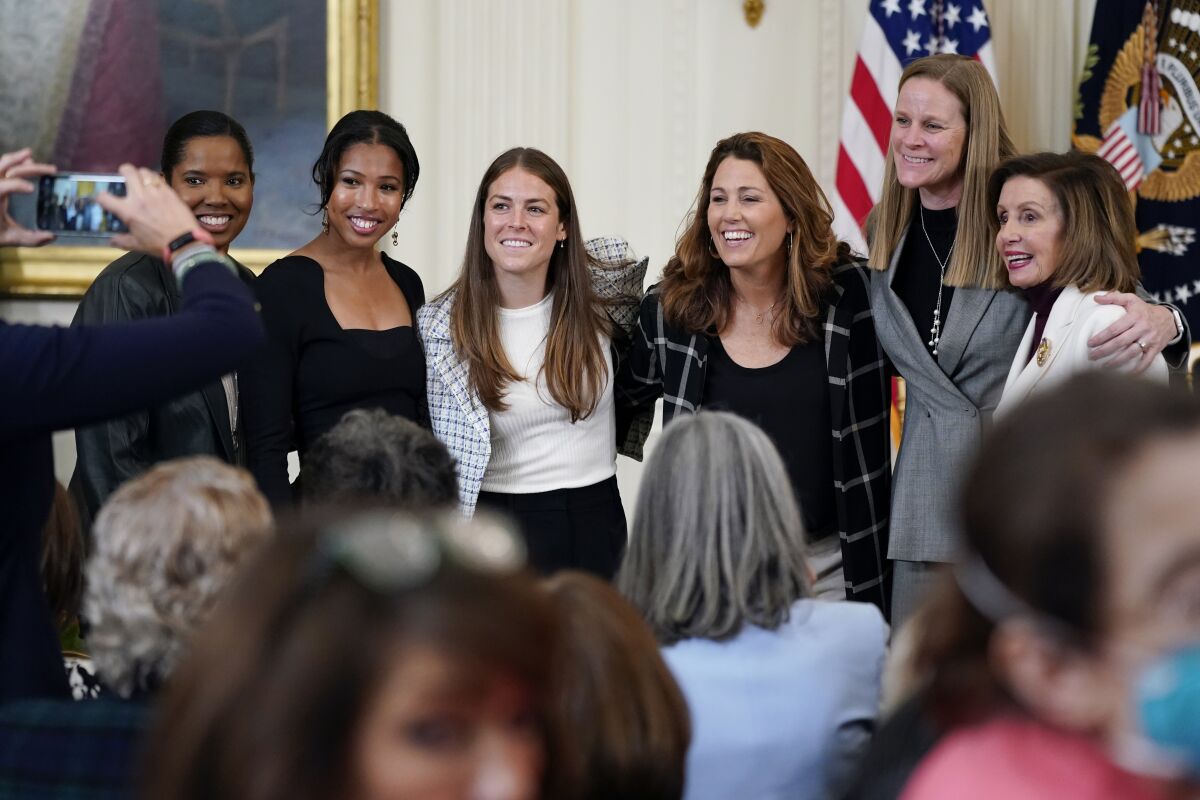 From left, Briana Scurry, Midge Purce, Kelley O'Hara, Julie Foudy and Cindy Parlow Cone with Speaker Nancy Pelosi.