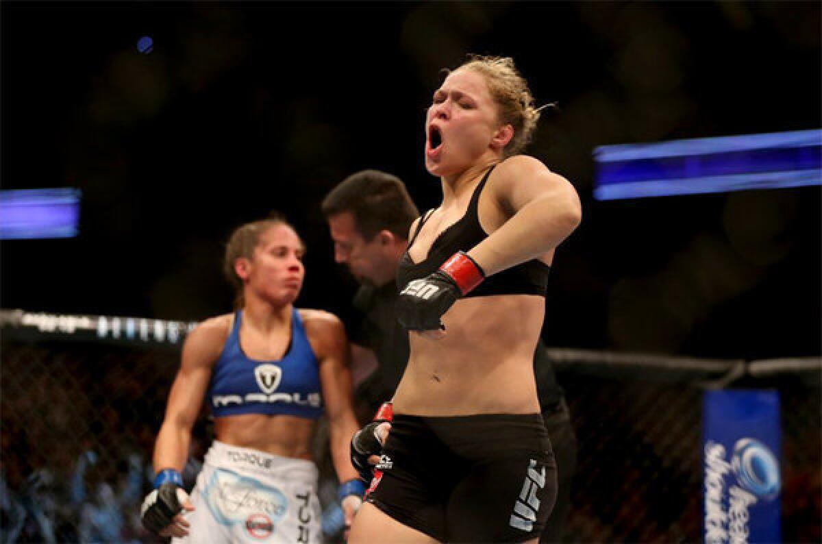 Ronda Rousey celebrates her UFC Bantamweight Title over Liz Carmouche.