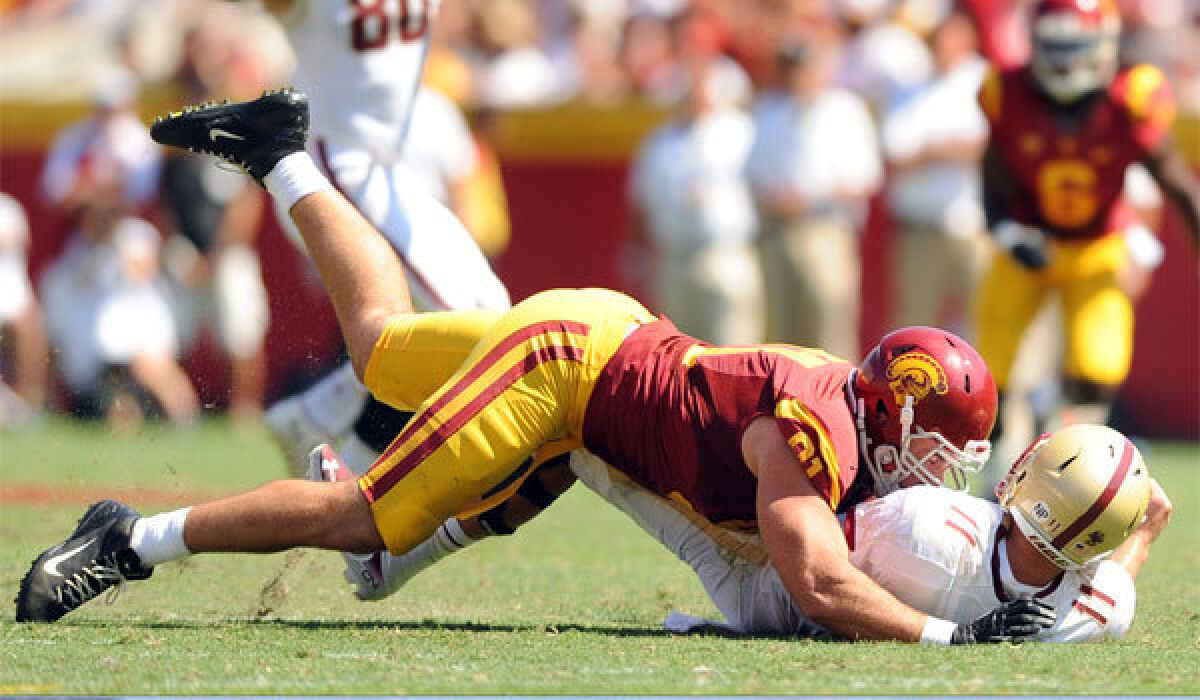 USC's Morgan Breslin takes down Boston College quarterback Chase Rettig during a 2013 game.