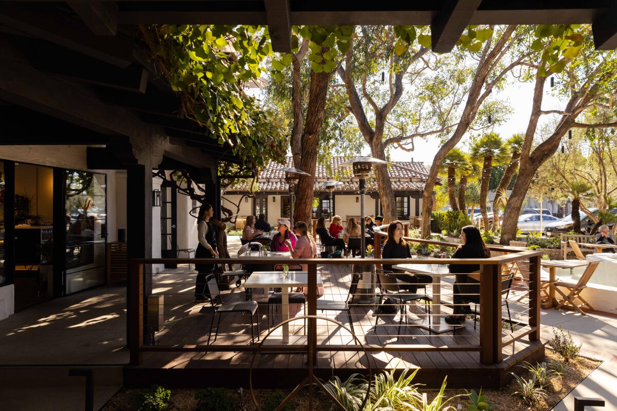 Milligram’s large wooden deck extends into Paseo 17’s courtyard.