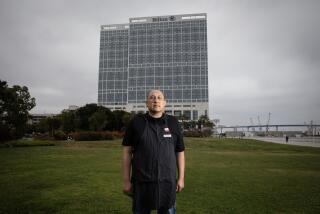 San Diego, California - April 30: Christian Carbajal, an employee at the Hilton San Diego Bayfront Hotel, will rally with other hotel works on International Worker's Day in San Diego, California.(Ana Ramirez / The San Diego Union-Tribune)