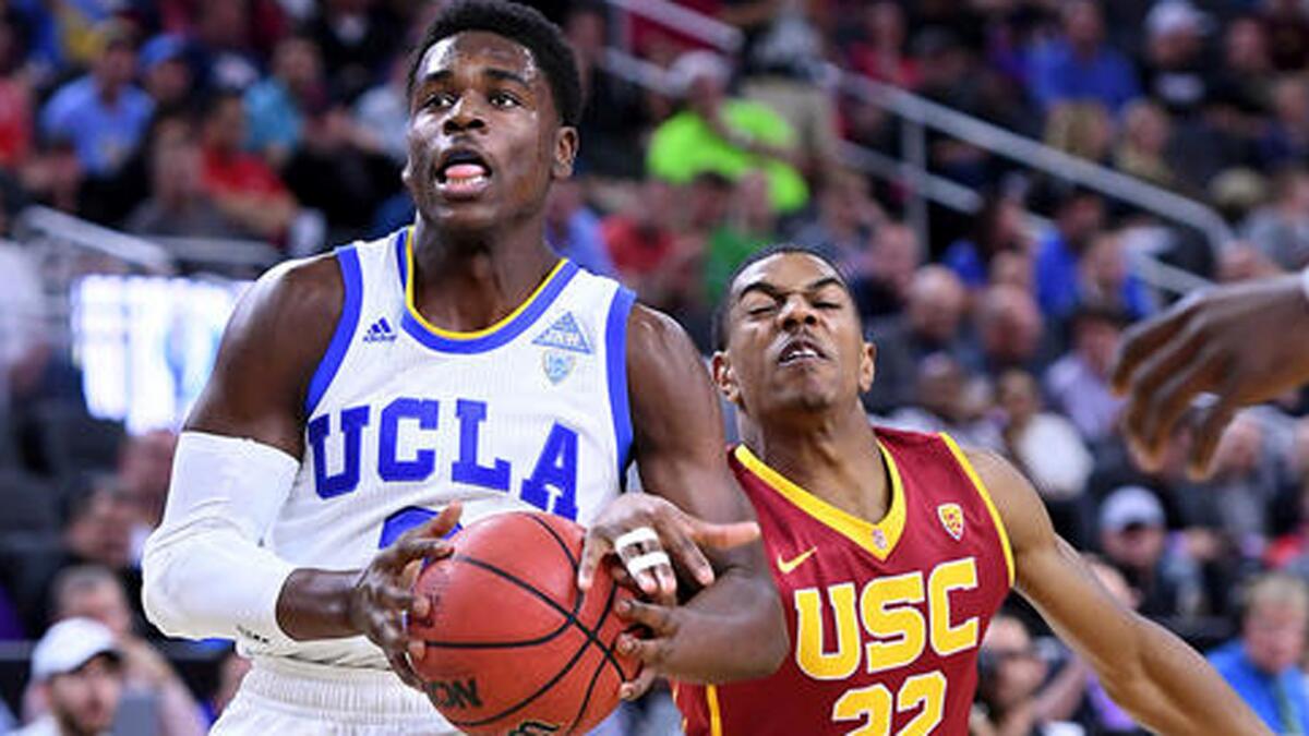 UCLA guard Aaron Holiday has the ball knocked away by USC guard De'Anthony Melton during the first half.
