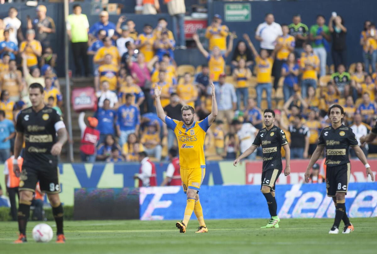 Tigres' Andre Pierre Gignac (R) celebrates after scoring against Sinaloa during their 2016 Mexican Clausura football tournament football match at the Universitario stadium in Monterrey, Mexico, on April 16, 2016. / AFP PHOTO / Julio Cesar Aguilar FuentesJULIO CESAR AGUILAR FUENTES/AFP/Getty Images ** OUTS - ELSENT, FPG, CM - OUTS * NM, PH, VA if sourced by CT, LA or MoD **