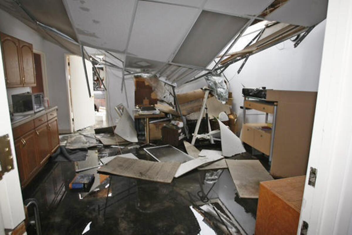 Adjacent to a larger roof collapse in a local warehouse, this office space was also damaged. No one was allowed to enter the area of the larger roof collapse.