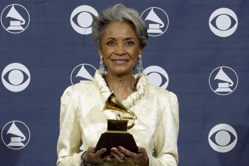 Hively, Ken   092686.CA.0213.grammy.KJH  Nancy Wilson poses with her award for best jazz vocal album for "R.S.V.P. (Rare Songs, Very Personal)" at the 47th annual Grammy Awards at the Staples Center in Los Angeles, Sunday, February 13, 2005.  PHOTO CREDIT: Ken Hively/Los Angeles Times