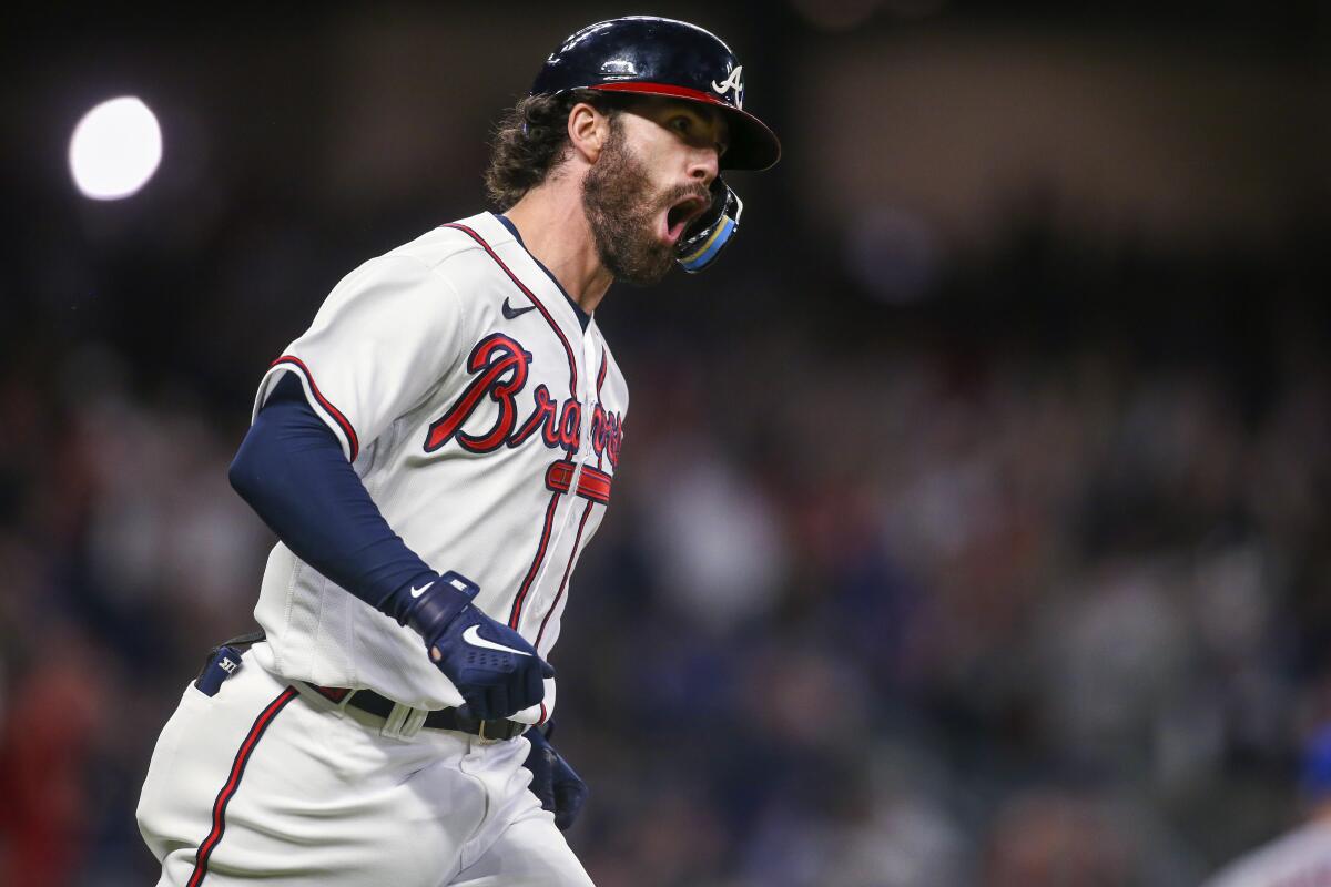 Atlanta's Dansby Swanson runs the bases after hitting a two-run home run.