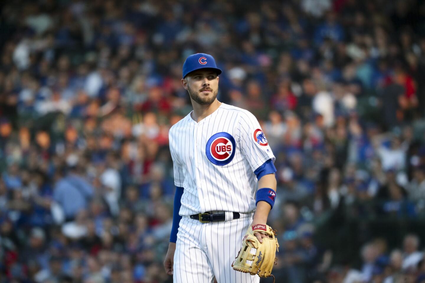 Cubs third baseman Kris Bryant walks on the field during the third inning against the Indians at Wrigley Field on Wednesday, May 23, 2018.