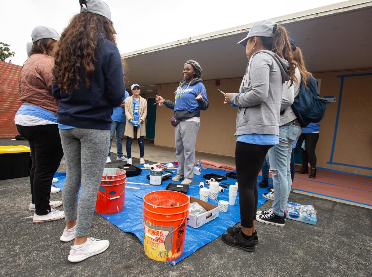 Aminata Diagne  of Pasadena  leads a group of volunteers during the day of service at Orville Wright STEAM Magnet.