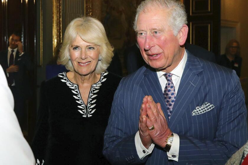 Britain's Prince Charles and Camilla, Duchess of Cornwall attend the annual Commonwealth day reception at Marlborough House, the home of the Commonwealth Secretariat, in London, Monday, March 9, 2020. (Aaron Chown/Pool Photo via AP)