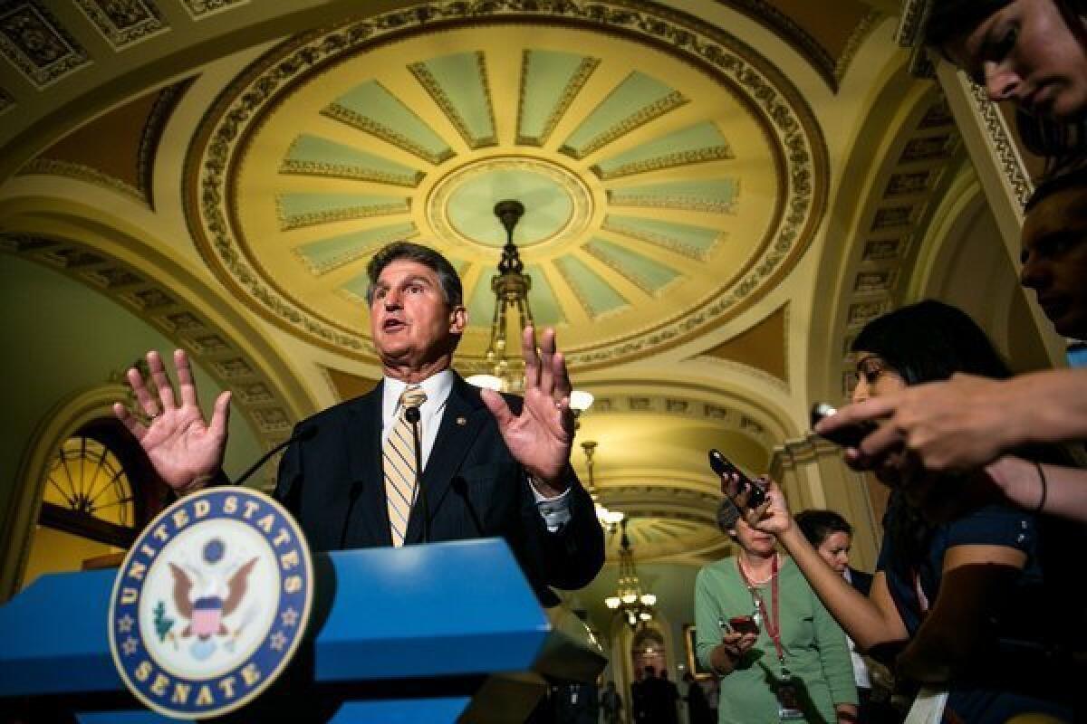 Sen. Joe Manchin (D-W.Va.) speaks during a news conference on student loan legislation after meeting with fellow Democratic senators.