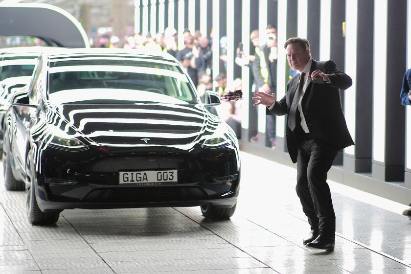 GRUENHEIDE, GERMANY - MARCH 22: Tesla CEO Elon Musk attends the official opening of the new Tesla electric car manufacturing plant on March 22, 2022 near Gruenheide, Germany. The new plant, officially called the Gigafactory Berlin-Brandenburg, is producing the Model Y as well as electric car batteries. (Photo by Christian Marquardt - Pool/Getty Images)