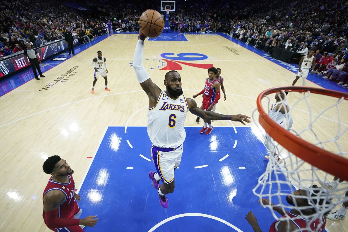 Lakers forward LeBron James elevates down the lane for a dunk.