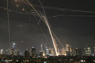 Israel's Iron Dome air defense system fires to intercept Iranian missiles over Tel Aviv on June 13.