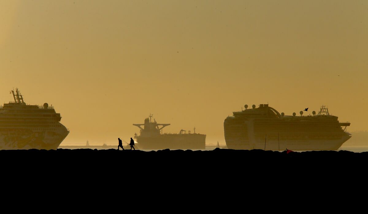 Fishermen set up on the Long Beach side of the San Gabriel River jetty