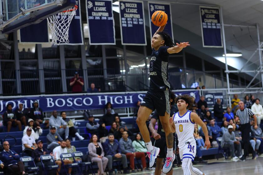 Elzie Harrington of St. John Bosco heads for a dunk against La Mirada.