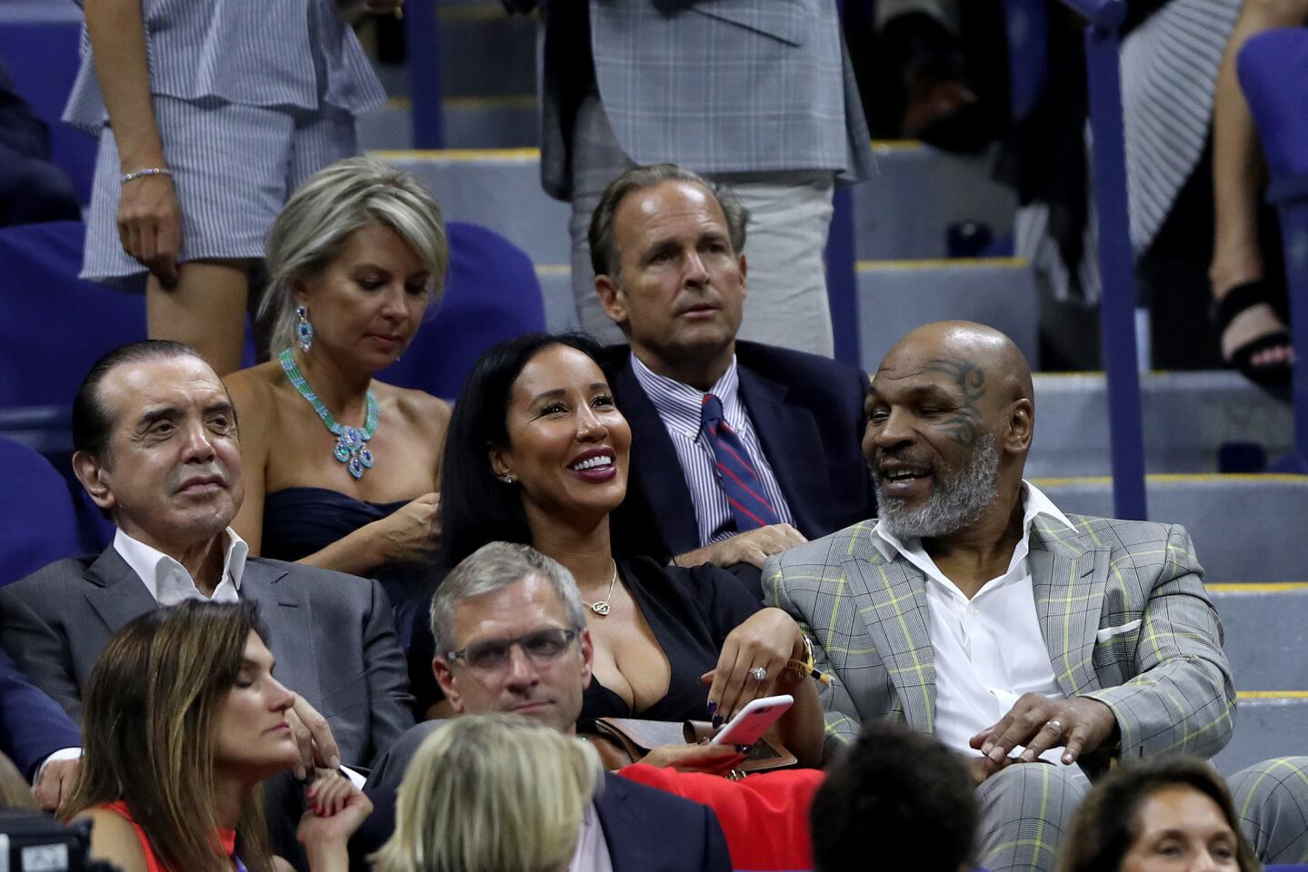 (L-R) Actor Chazz Palminteri,left, Lakiha Spicer (Mike Tyson's wife) and Mike Tyson attend the Women's Singles first-round match at the 2019 U.S. Open at the USTA Billie Jean King National Tennis Center on Aug. 26, 2019, in Flushing, Queens.