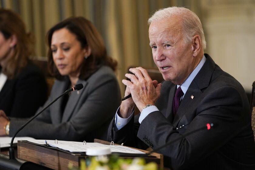 President Joe Biden speaks during a meeting of the reproductive rights task force in the State Dining Room of the White House in Washington, Tuesday, Oct. 4, 2022. Vice President Kamala Harris listens at left. (AP Photo/Susan Walsh)