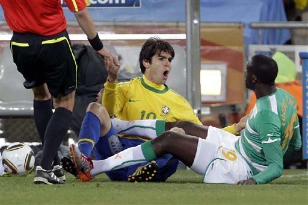 Brazil's Kaka, left, shouts to Ivory Coast's Yaya Toure during the World Cup group G soccer match between Brazil and Ivory Coast at Soccer City in Johannesburg, South Africa, Sunday, June 20, 2010. (AP Photo/Frank Augstein)