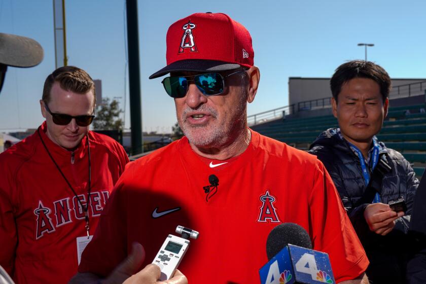 TEMPE, ARIZ. - FEBRUARY 17: Los Angeles Angels Joe Maddon speaks with reporters.