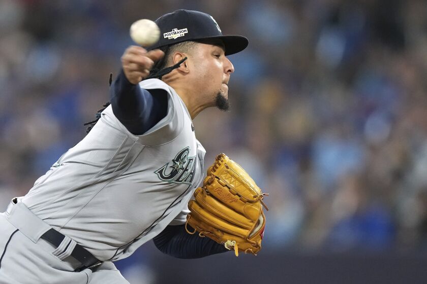 Seattle Mariners starting pitcher Luis Castillo throws against the Toronto Blue Jays during the third inning Game 1 in an AL wild-card baseball playoff series in Toronto on Friday, Oct. 7, 2022. (Nathan Denette/The Canadian Press via AP)