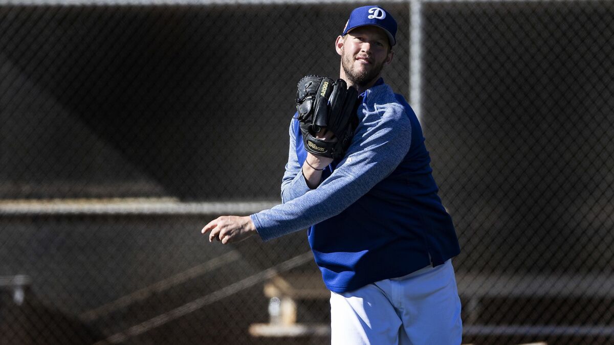 Dodgers pitcher Clayton Kershaw plays catch during spring training at Camelback Ranch on February 19.